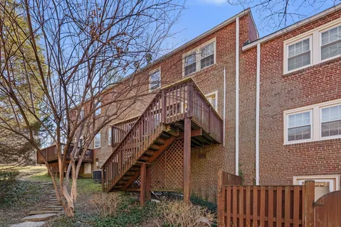 a view of a house with a small yard