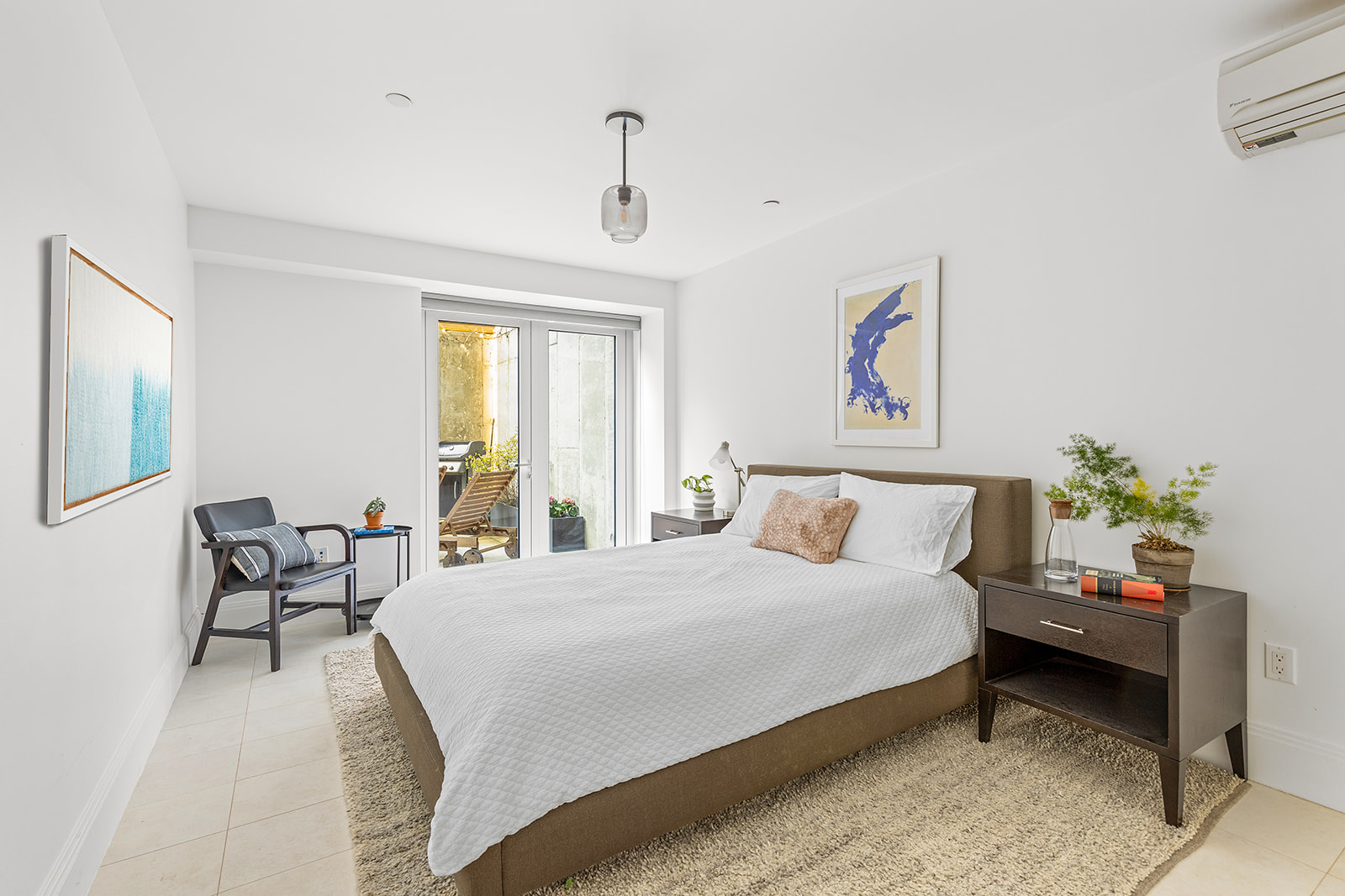 610 Warren Street, Unit GDNB Brooklyn, NY 11217 - Photo 7 of 17 a bedroom with a bed a couch and a window