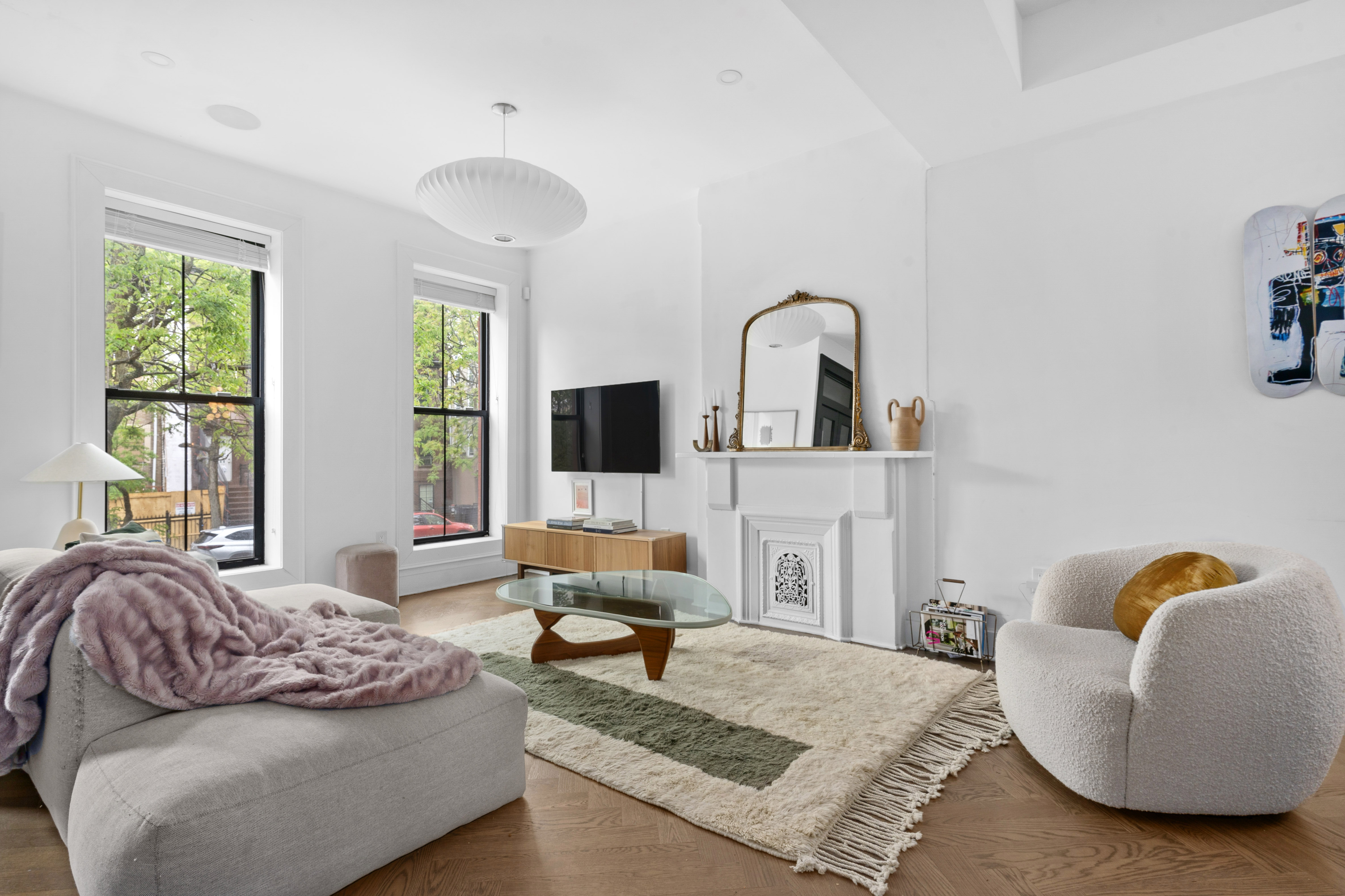 a living room with furniture and a flat screen tv