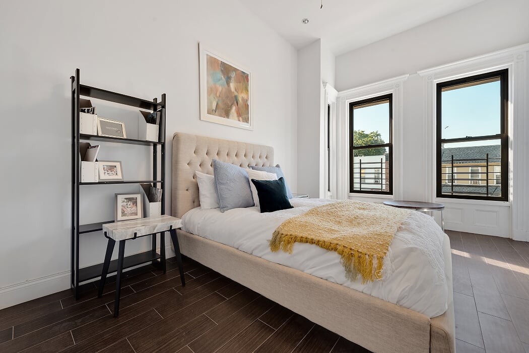 16 Pilling Street Brooklyn, NY 11207 - Photo 8 of 11 a bedroom with a bed and wooden floor