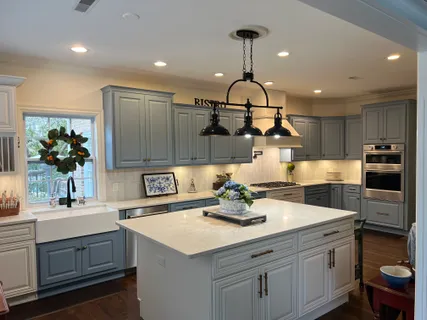 a kitchen with a sink stainless steel appliances and cabinets
