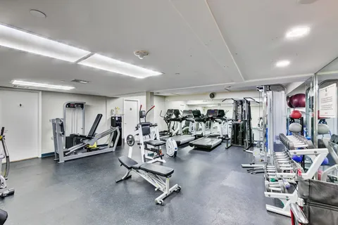 a dining room with a table and chairs
