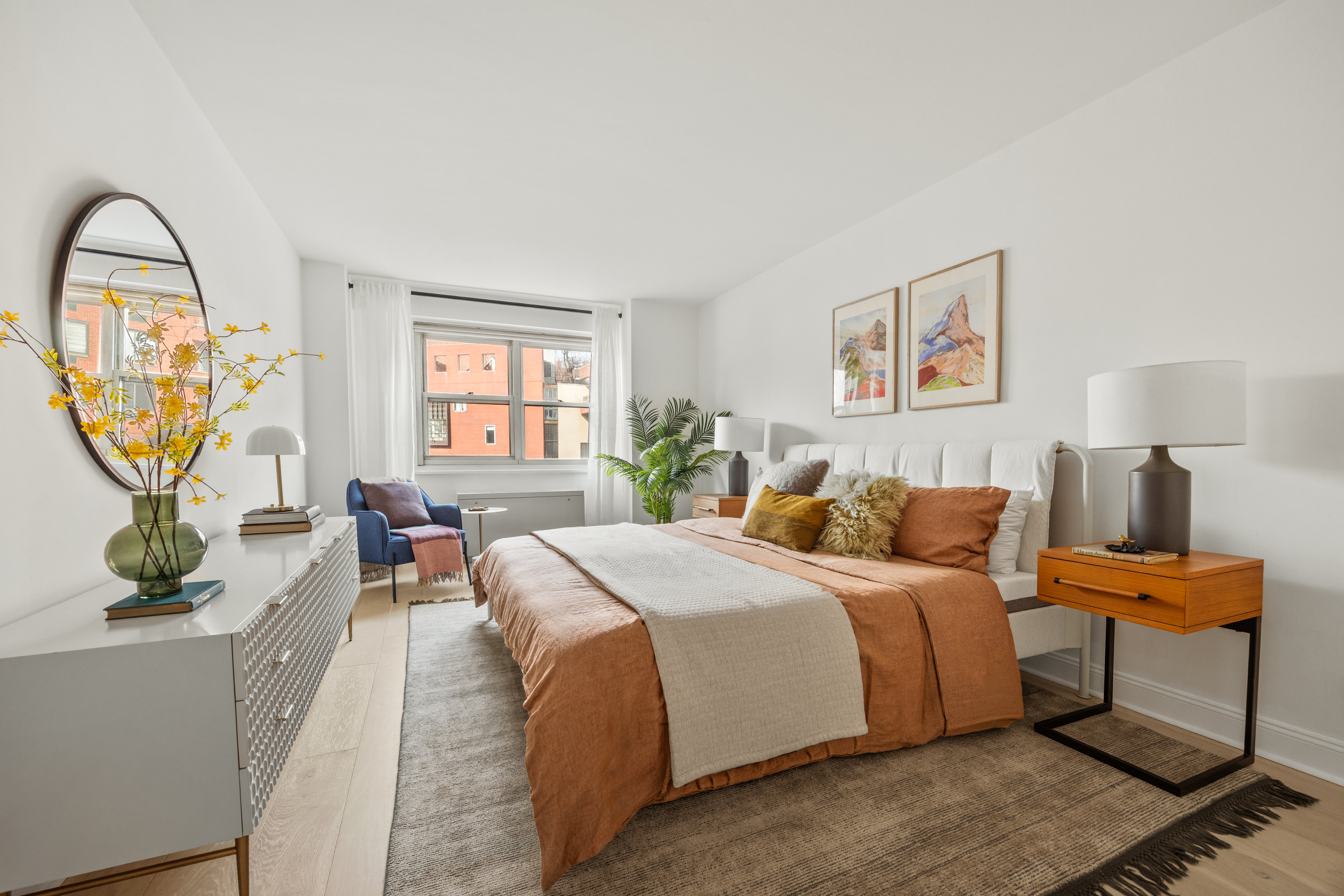 15 Charles Street, Unit 2H Manhattan, NY 10014 - Photo 3 of 12 a bed room with a bed and a potted plant
