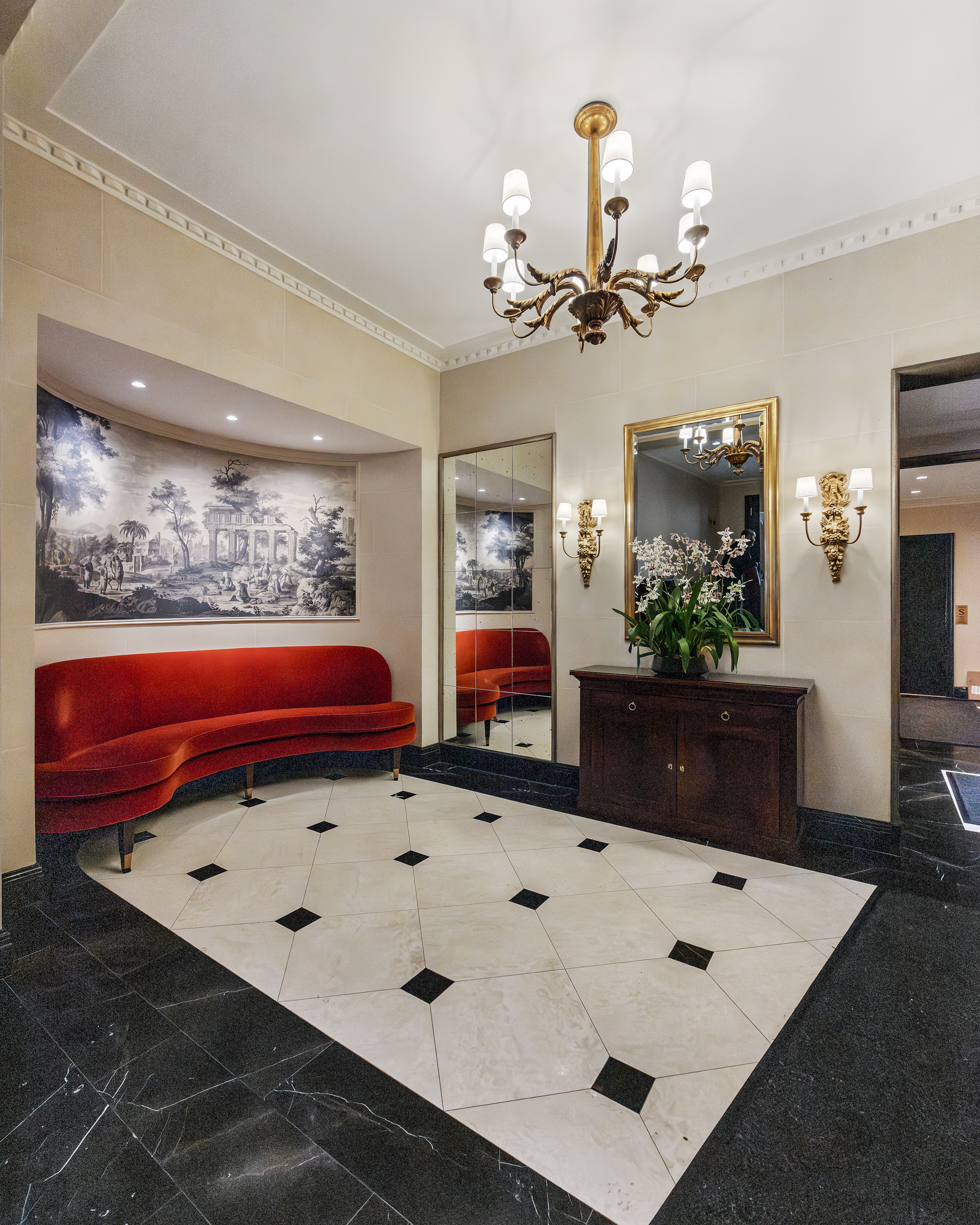 169 East 78th Street, Unit 7C Manhattan, NY 10075 - Photo 28 of 30 a living room with furniture and chandelier