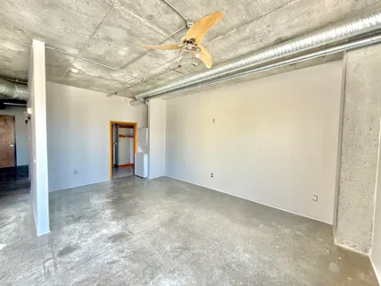 a view of a electric appliances in kitchen and empty room