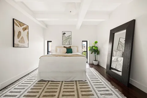 a living room with furniture and a rug