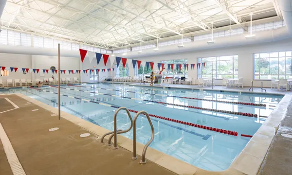 a view of swimming pool with outdoor seating