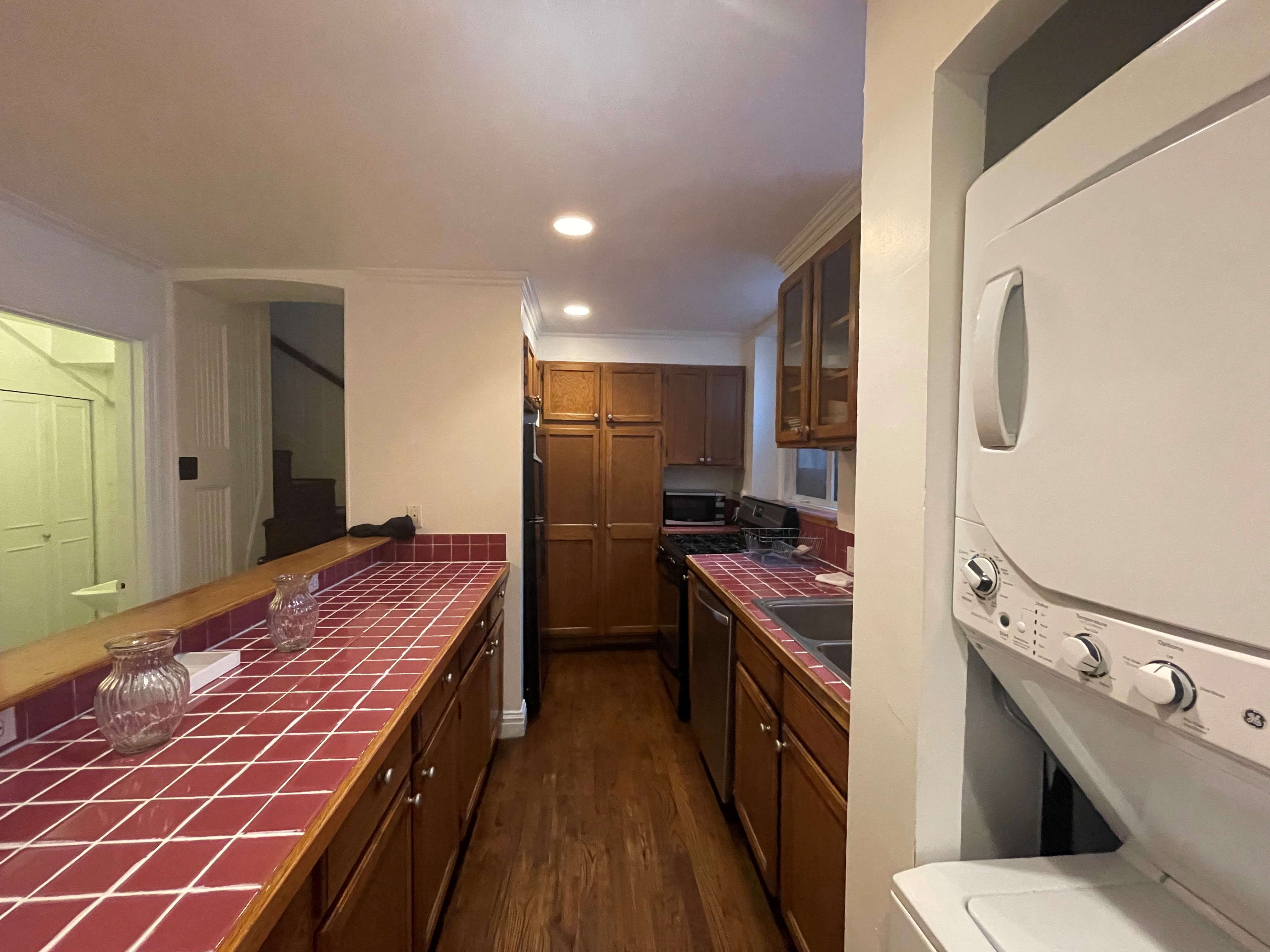 120 East 10th Street, Unit 1 Manhattan, NY 10003 - Photo 12 of 24 a kitchen with stainless steel appliances a sink stove and refrigerator