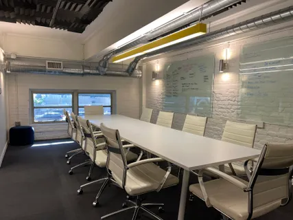 a workspace with furniture and wooden floor