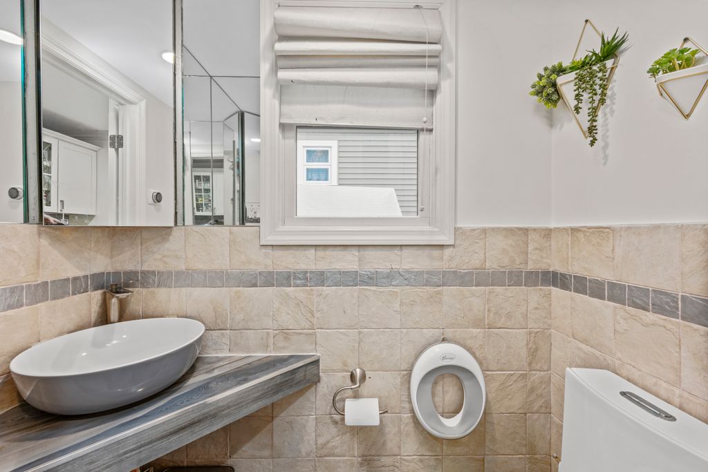 79 Sparkill Avenue Staten Island, NY 10304 - Photo 17 of 32 a bathroom with a toilet and a sink