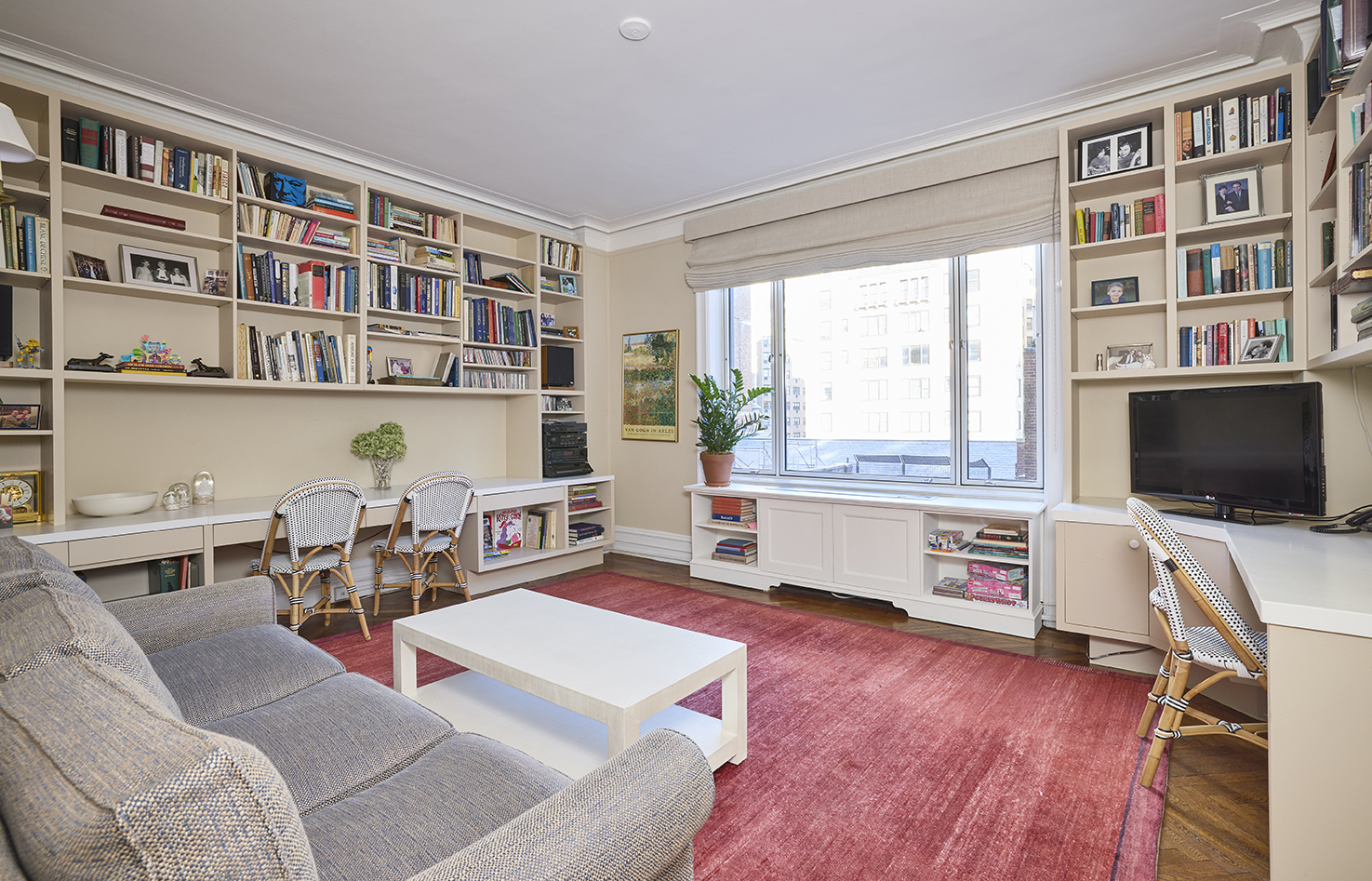 161 East 79th Street, Unit 7B Manhattan, NY 10075 - Photo 3 of 15 a living room with furniture and a flat screen tv