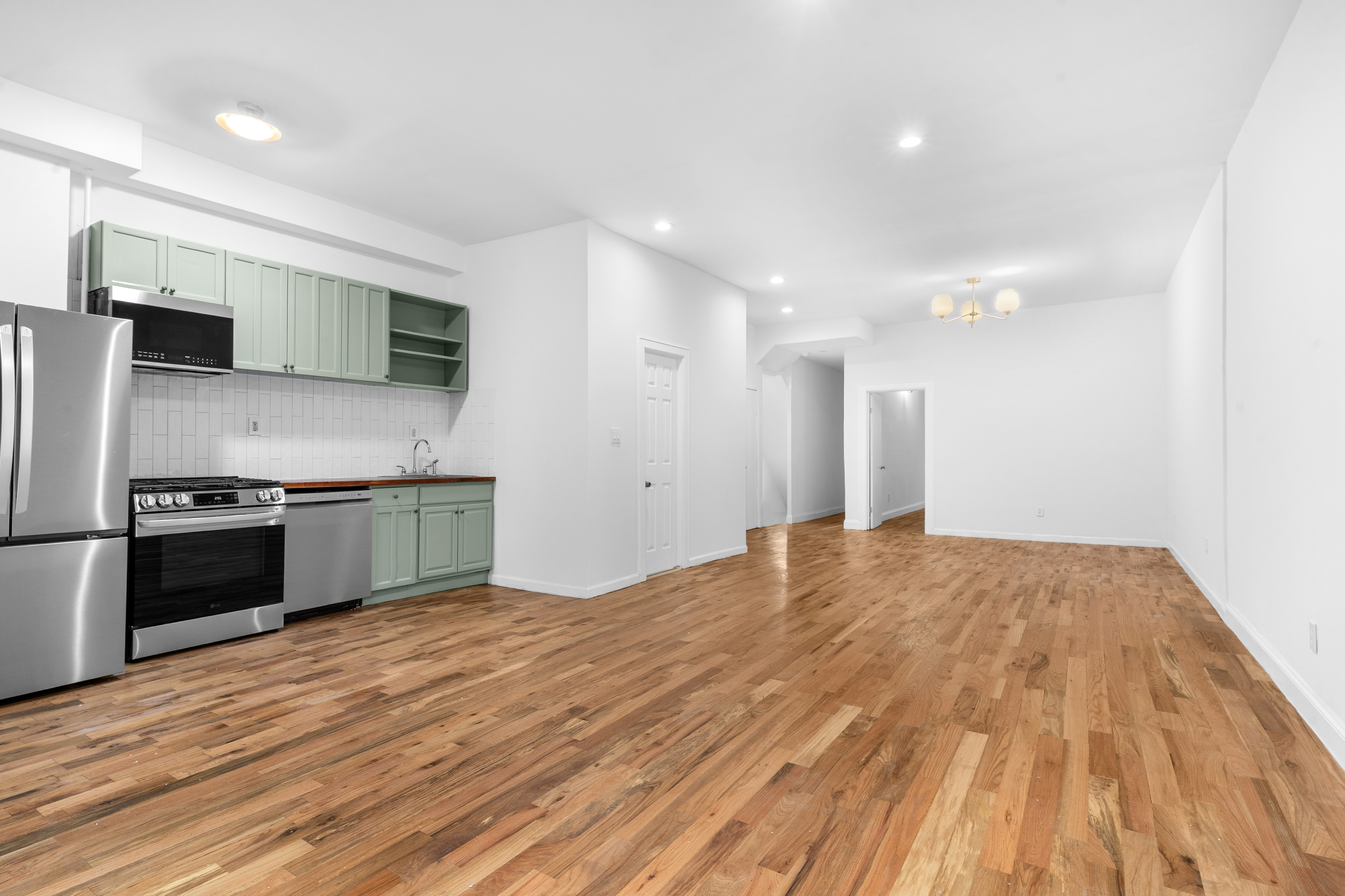 339 East 29th Street Brooklyn, NY 11226 - Photo 7 of 21 a kitchen with stainless steel appliances a refrigerator and a microwave