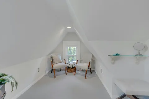 an aerial view of a house with yard swimming pool and outdoor seating
