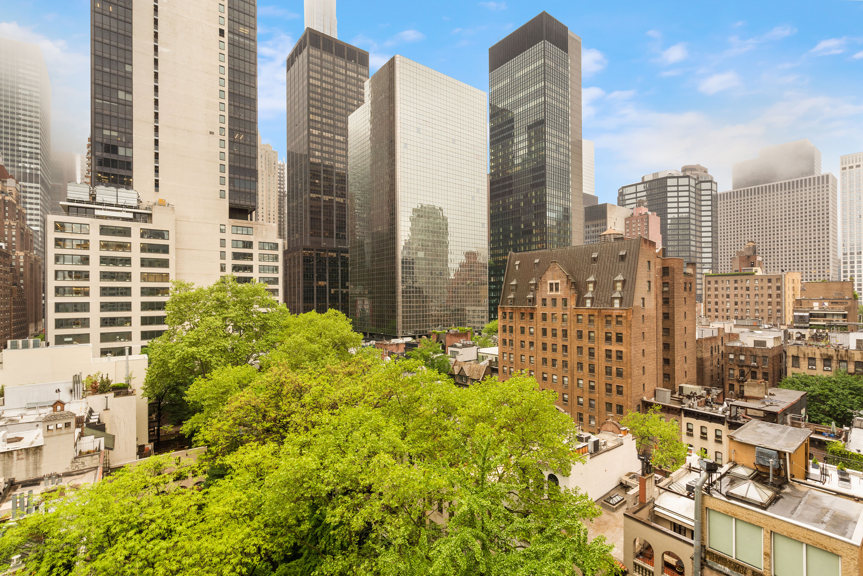 249 East 48th Street, Unit 12A Manhattan, NY 10017 - Photo 2 of 9 a view of a city with tall buildings