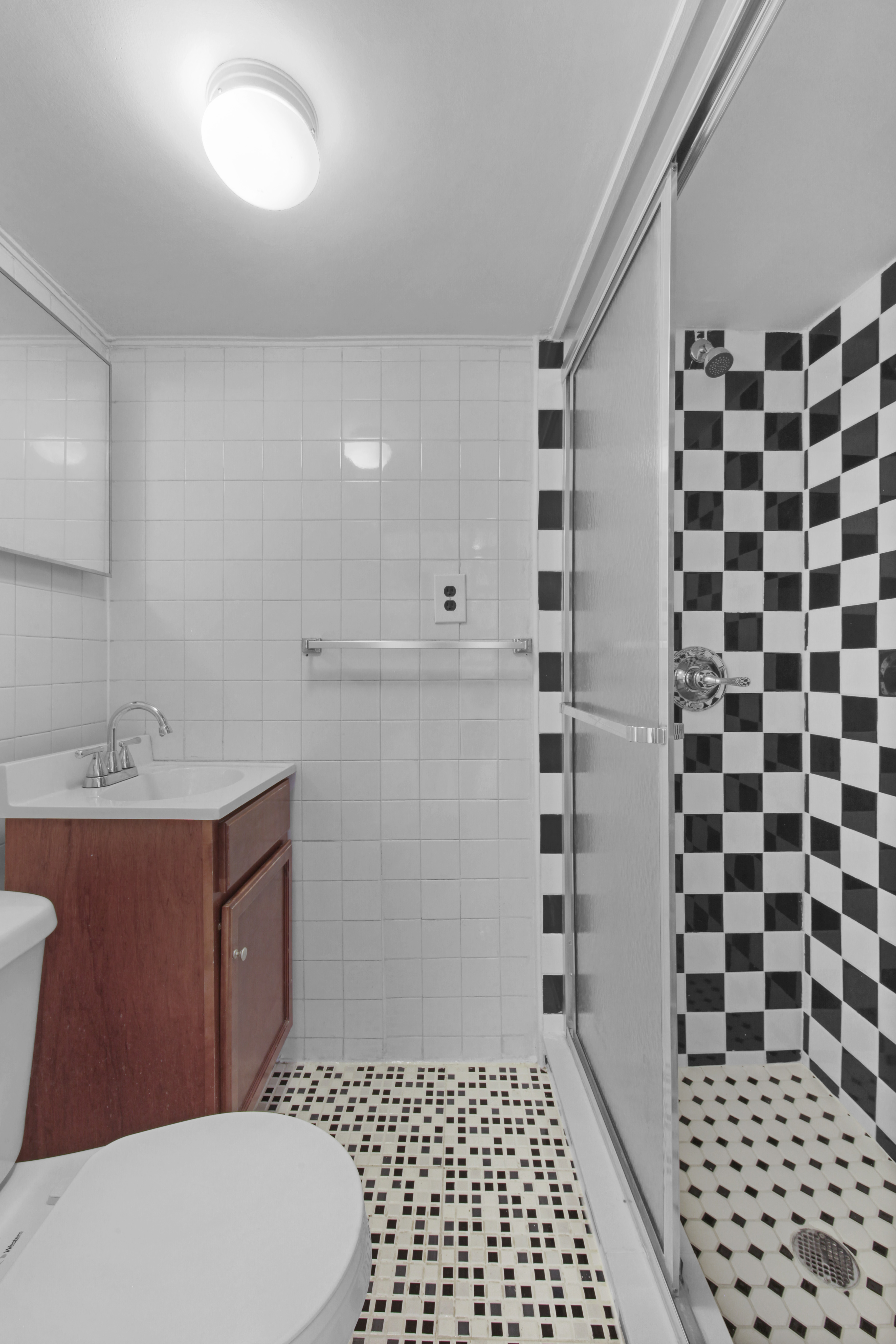 155 Hicks Street, Unit 2B Brooklyn, NY 11201 - Photo 6 of 11 a bathroom with a sink a toilet and shower