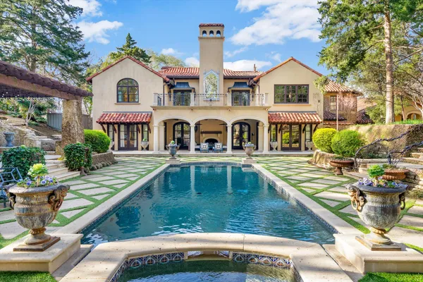 a view of a house with swimming pool