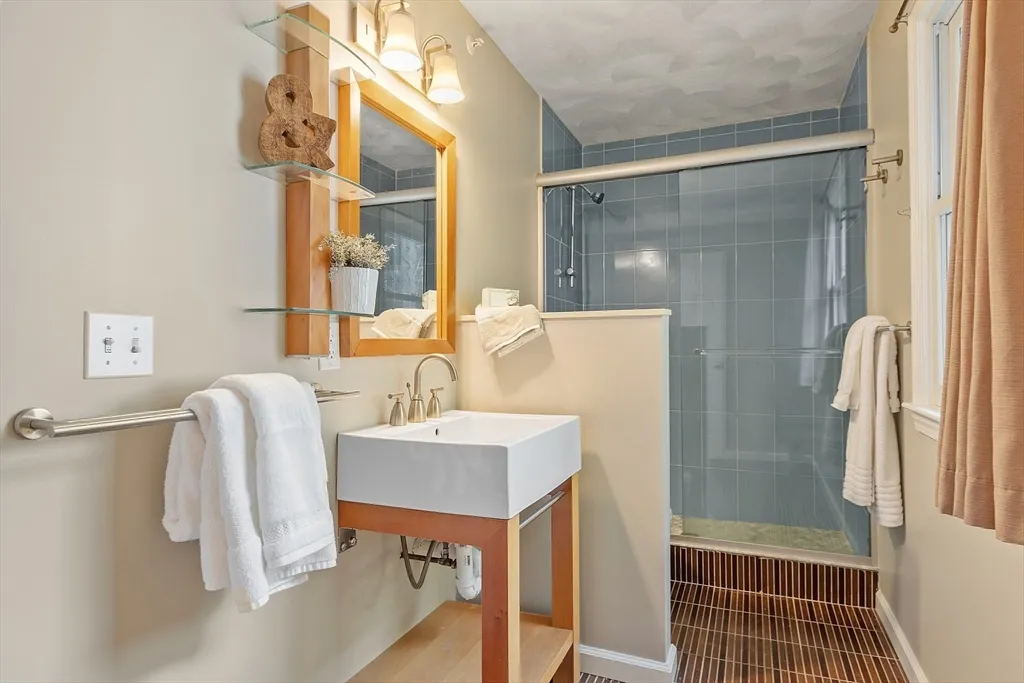 a bathroom with a sink and mirror