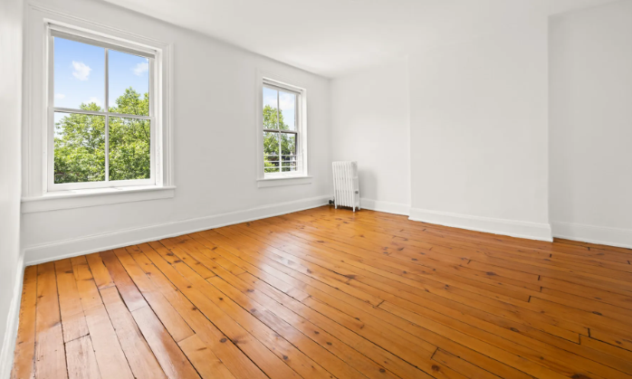 138 State Street Brooklyn, NY 11201 - Photo 7 of 13 an empty room with wooden floor and windows
