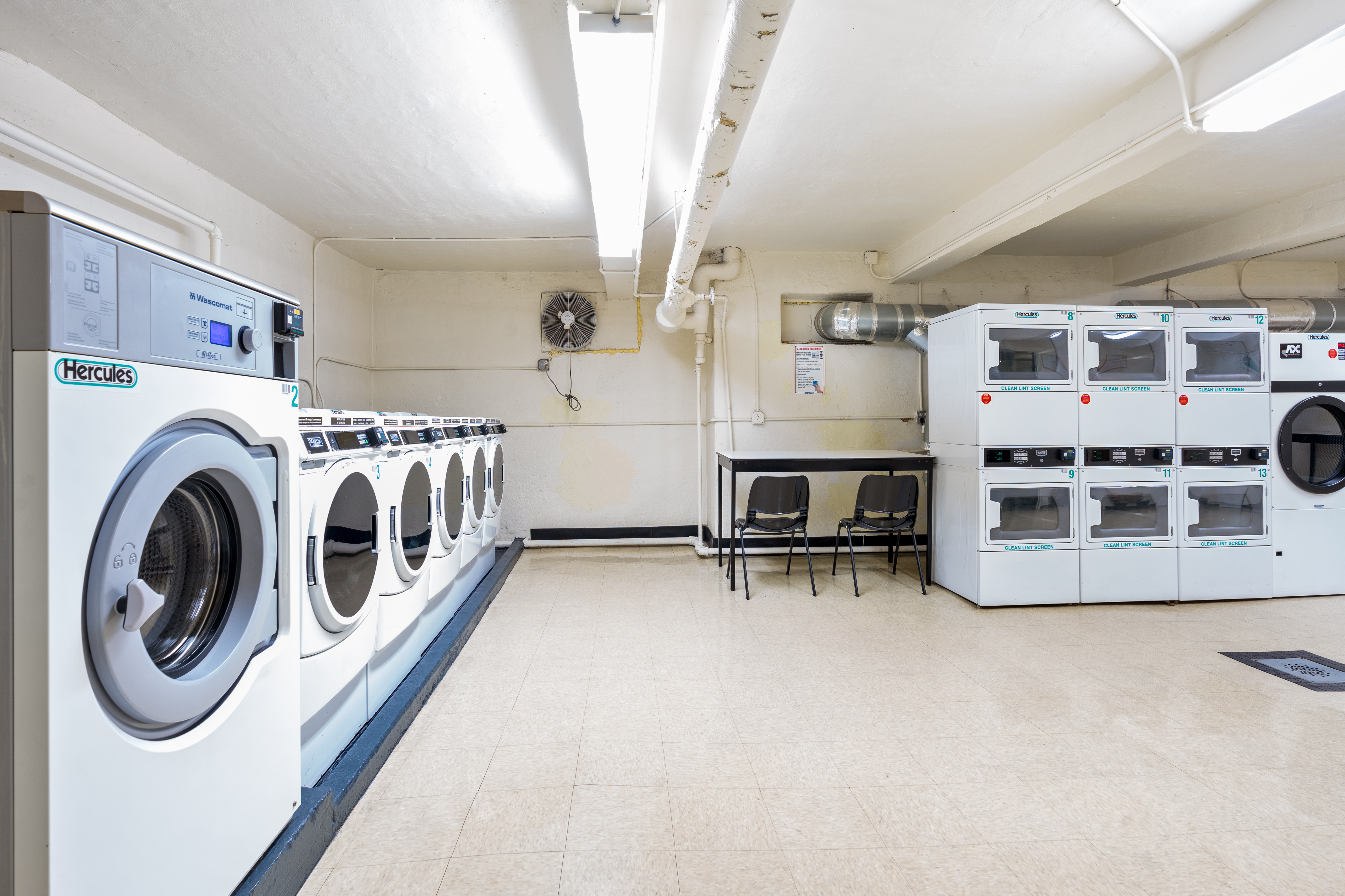 68-63 108th Street, Unit 1B Queens, NY 11375 - Photo 9 of 13 a utility room with dryer and washer