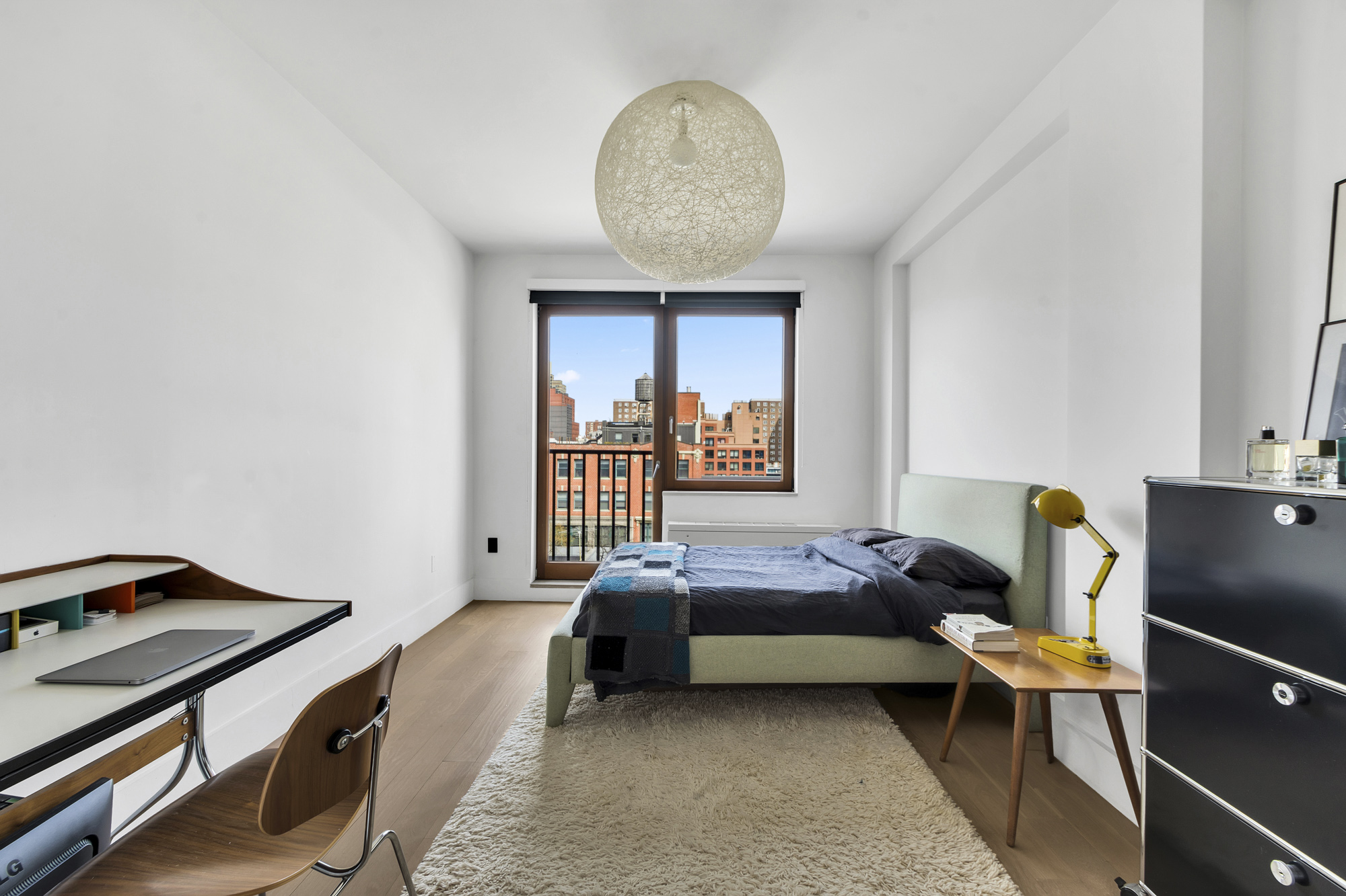 267 West 124th Street, Unit 6A Manhattan, NY 10027 - Photo 18 of 24 a bedroom with a bed and a window