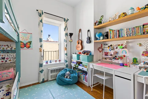 a storage room with lots of furniture and toys