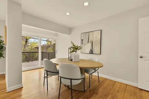 a view of a balcony with door and wooden floor