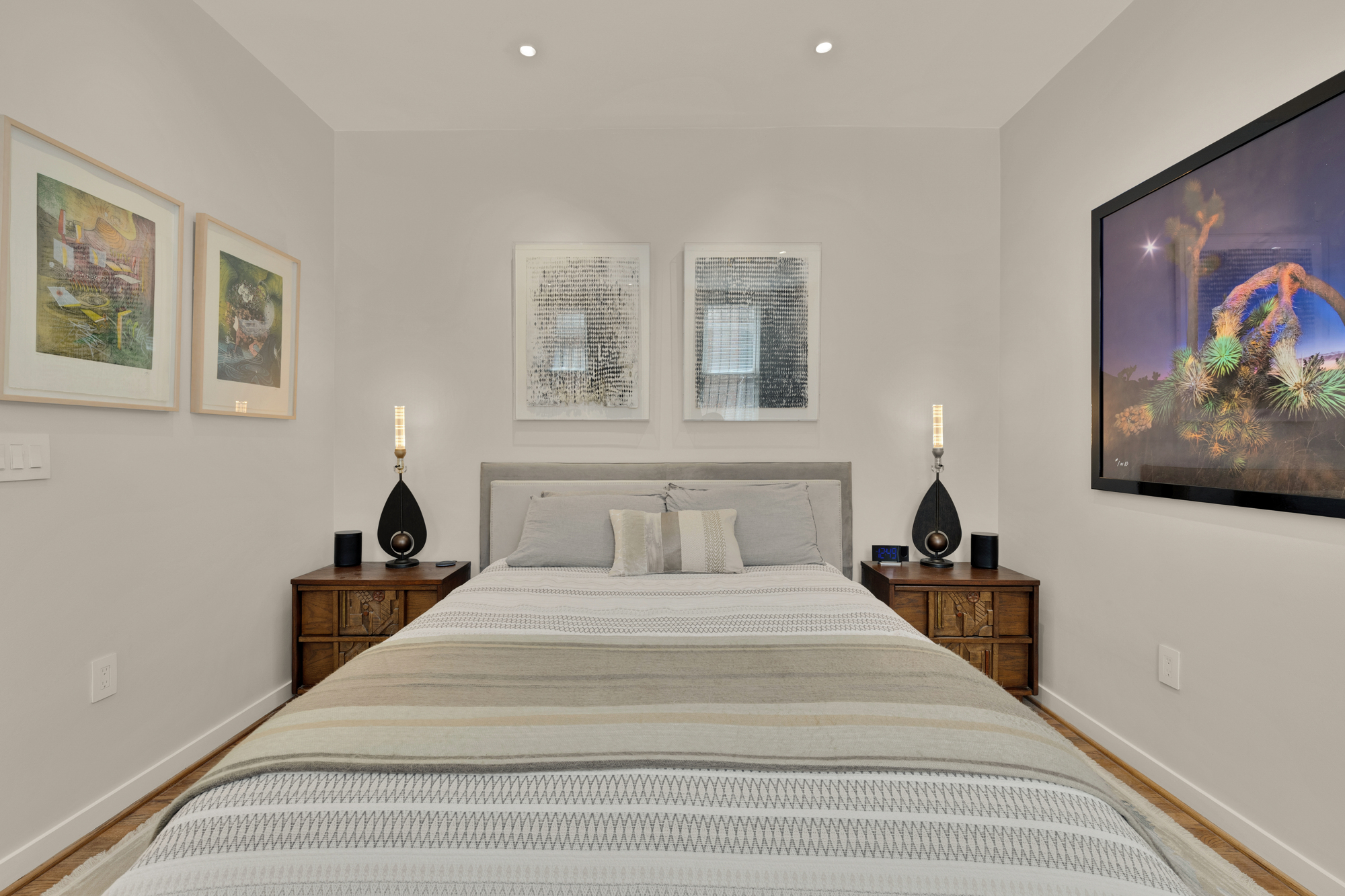 1407 15th Street Northwest, Unit 2 Washington, DC 20005 - Photo 14 of 24 a bedroom with a bed and a painting on the wall