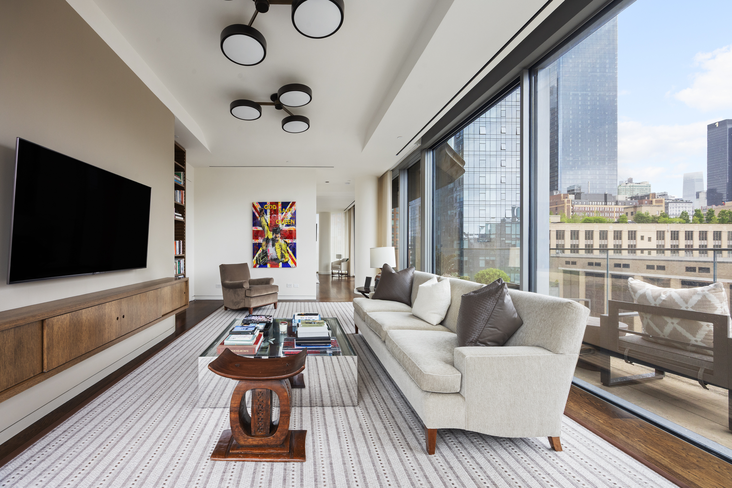520 West 28th Street, Unit PH37 Manhattan, NY 10001 - Photo 27 of 45 a living room with furniture and a flat screen tv