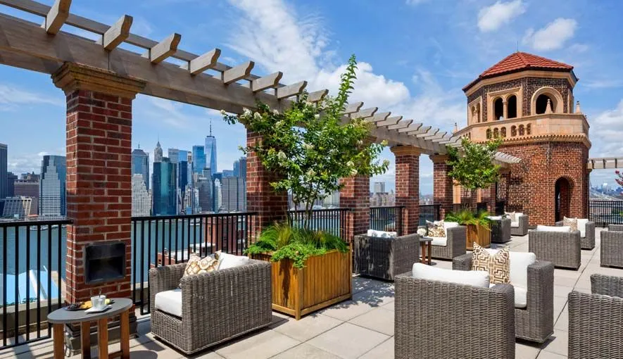 a view of a patio with couches table and chairs