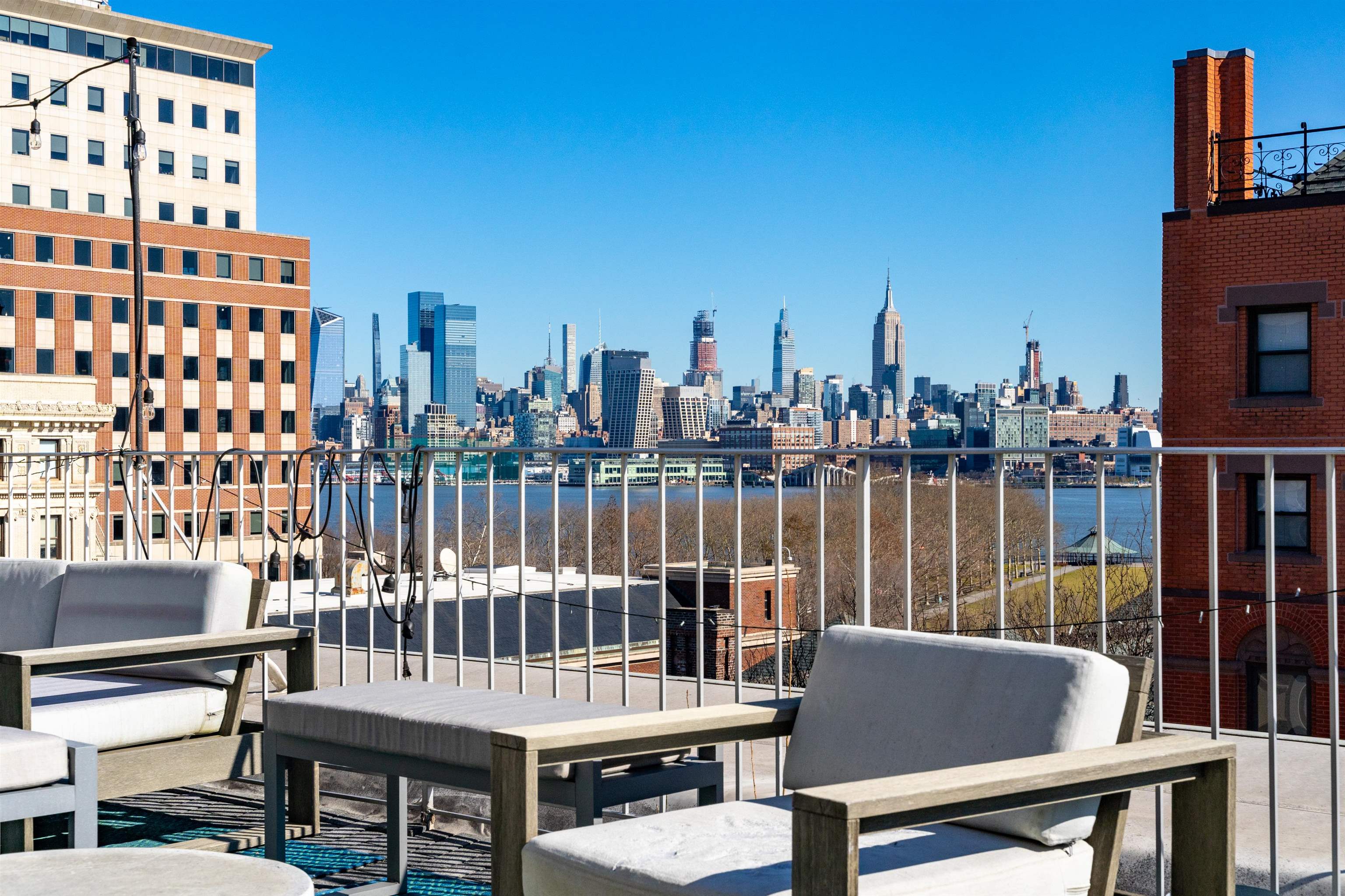 80 River Street, Unit PHNORTH Hoboken, NJ 07030 - Photo 15 of 24 a balcony with a water view