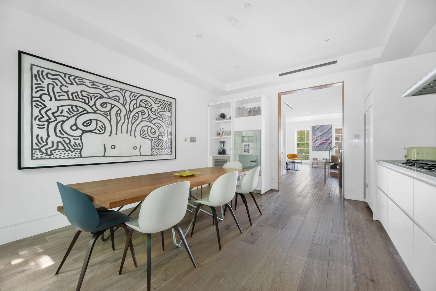 440 West 20th Street Manhattan, NY 10011 - Photo 2 of 35 a view of a dining room with furniture and wooden floor