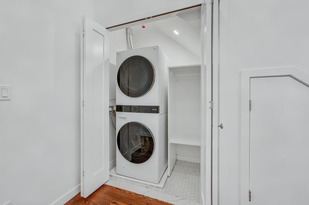 109 President Street, Unit 2 Brooklyn, NY 11231 - Photo 10 of 20 a view of a hallway with washer and dryer