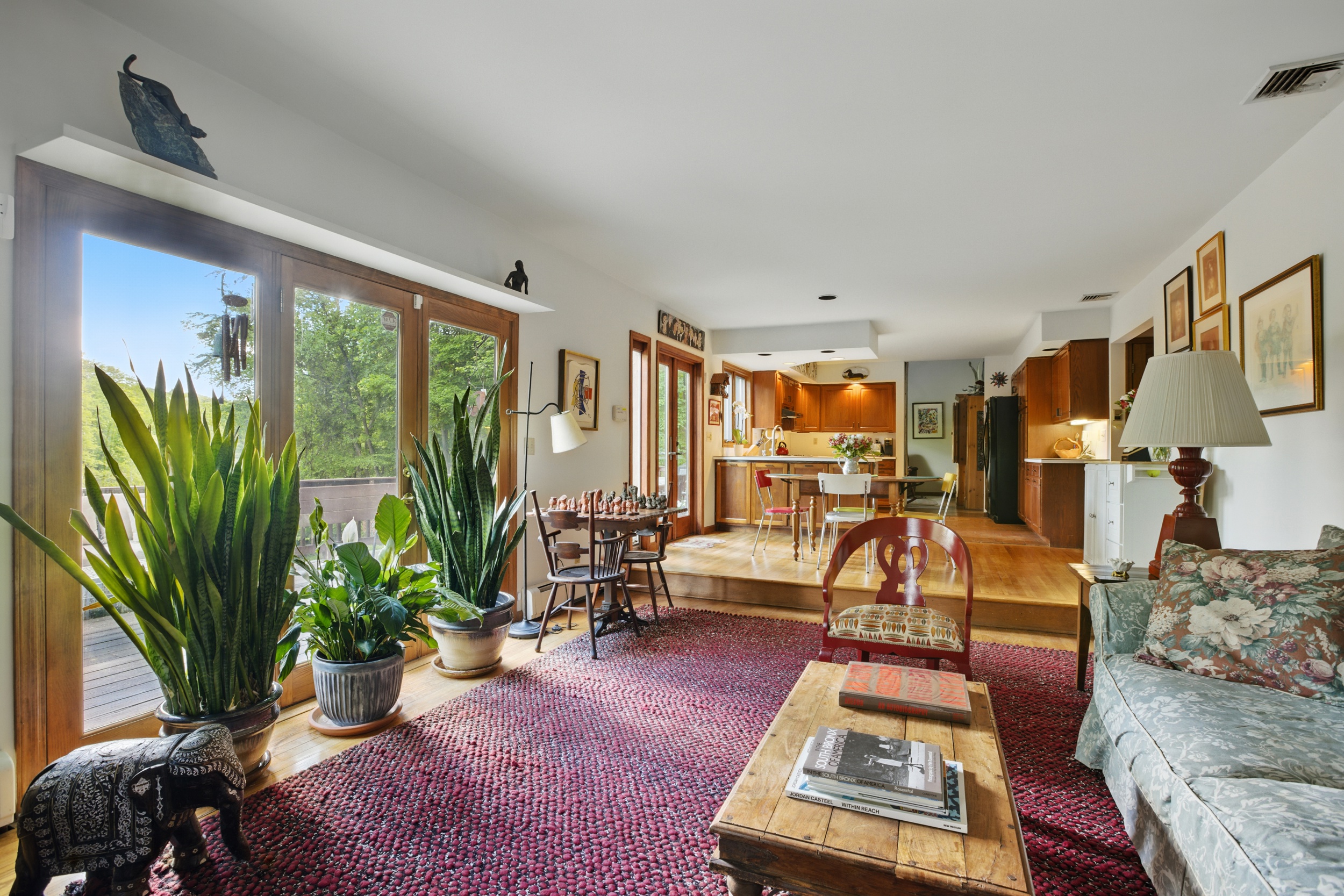 19 Pond Road Cold Spring, NY 10516 - Photo 12 of 32 a living room with furniture floor to ceiling window and potted plant