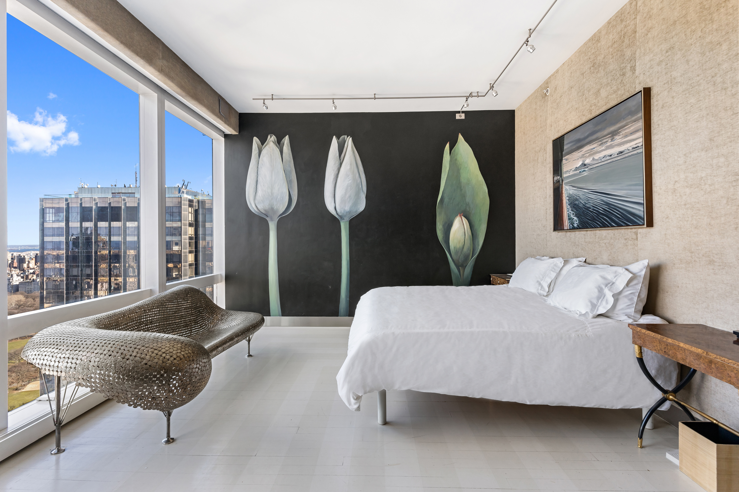 80 Columbus Circle, Unit 67B Manhattan, NY 10019 - Photo 4 of 16 a living room with furniture and a large window