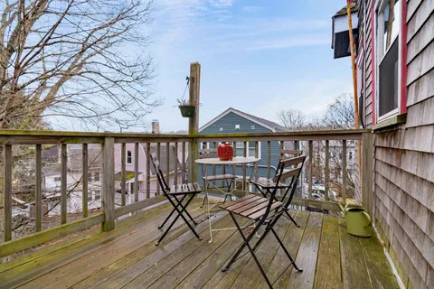 a small pool with a bench and trees