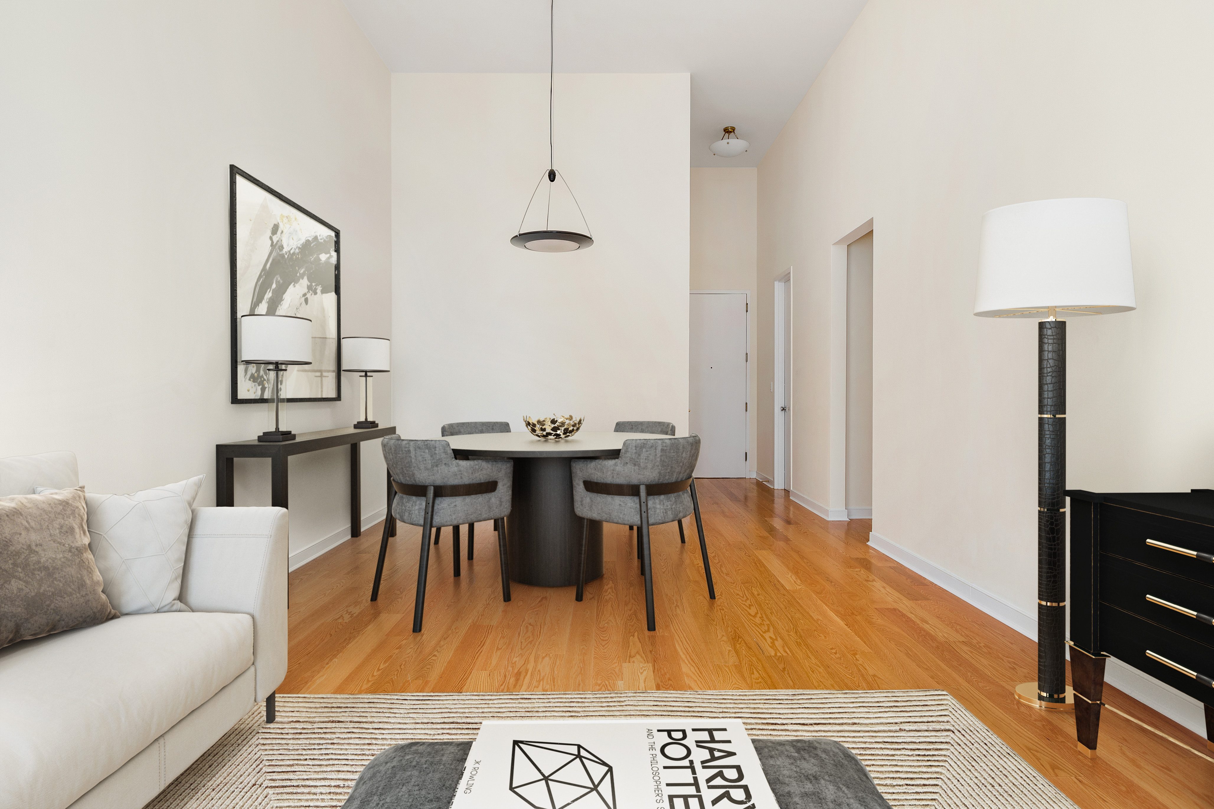 120 East 87th Street, Unit R10C Manhattan, NY 10128 - Photo 2 of 13 a living room with furniture a rug and a table