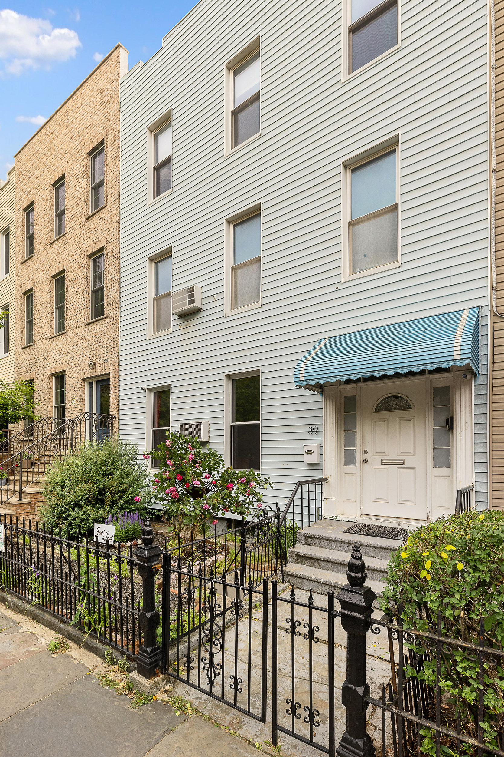 39 Broome Street Brooklyn, NY 11222 - Photo 1 of 16 a front view of multiple houses with glass windows