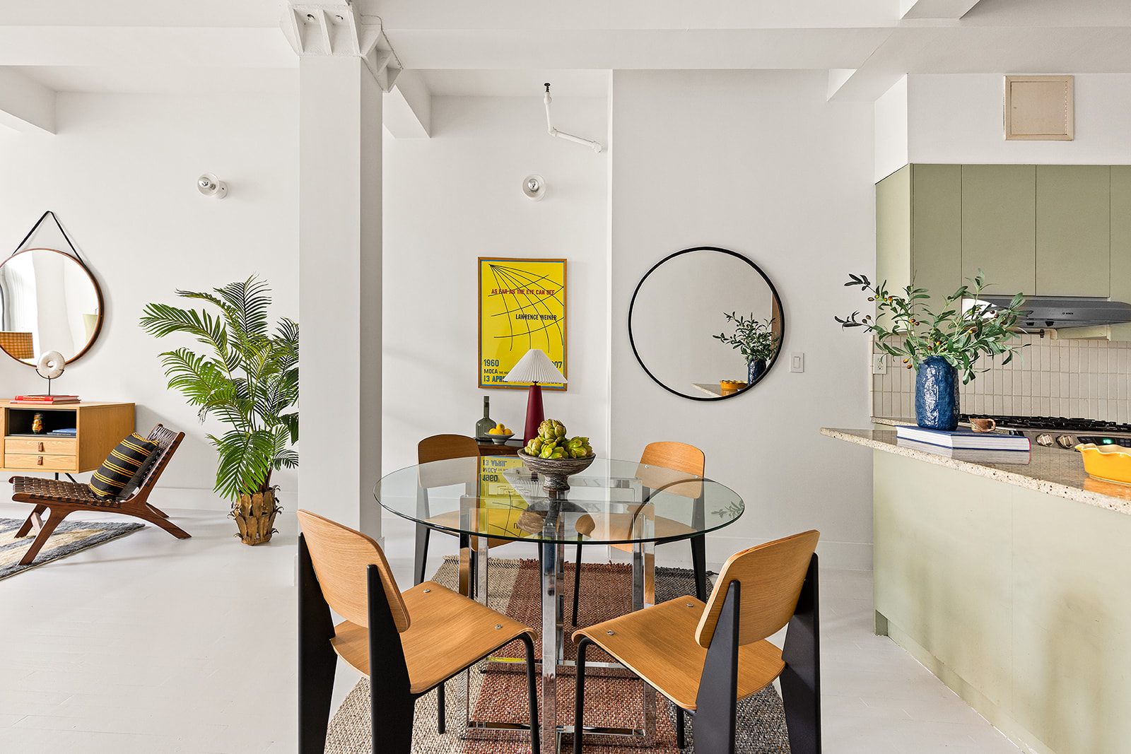 91 Grand Avenue, Unit 2A Brooklyn, NY 11205 - Photo 4 of 10 a dining room with furniture and a mirror