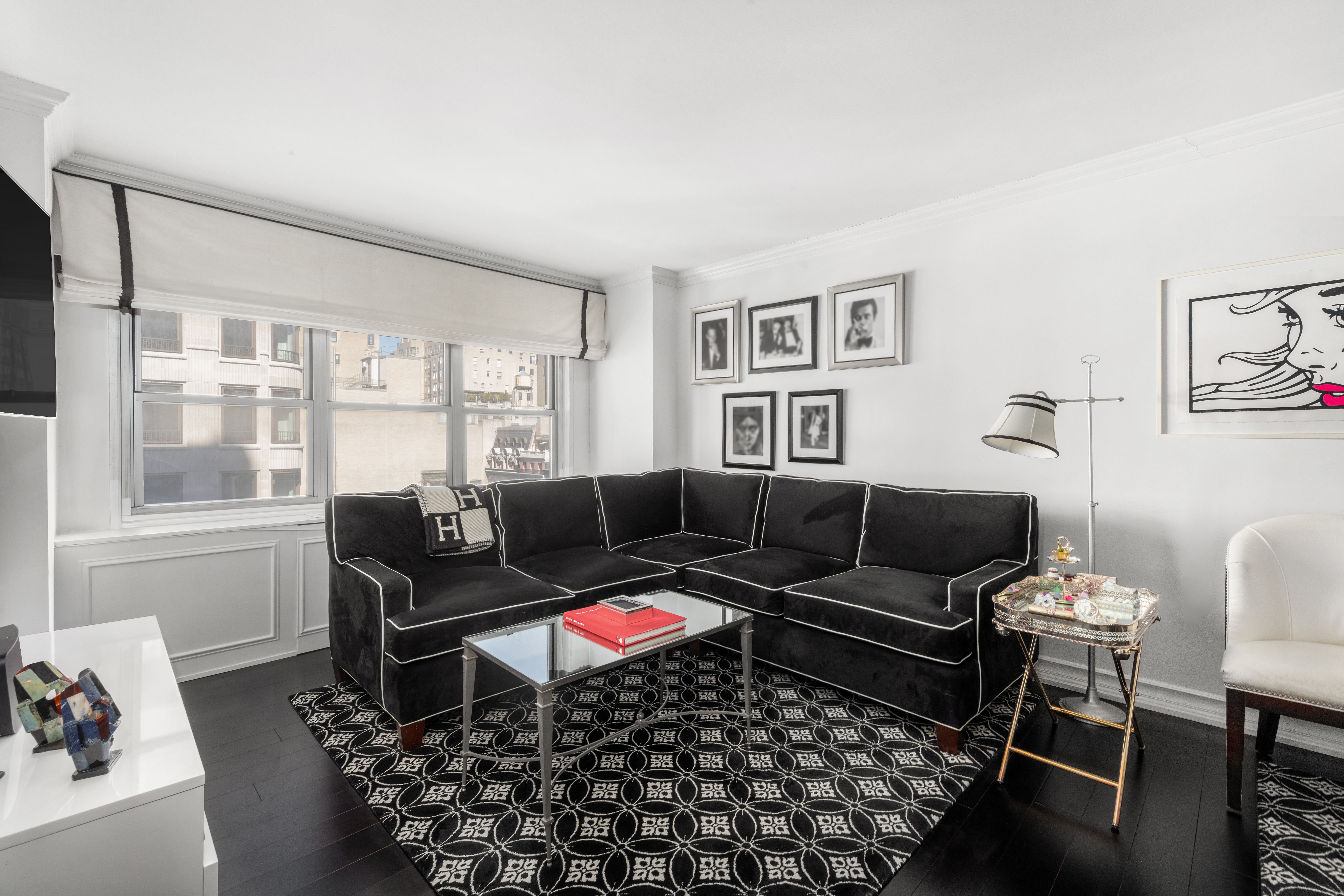 27 East 65th Street, Unit 10BC Manhattan, NY 10065 - Photo 3 of 16 a living room with furniture and a window