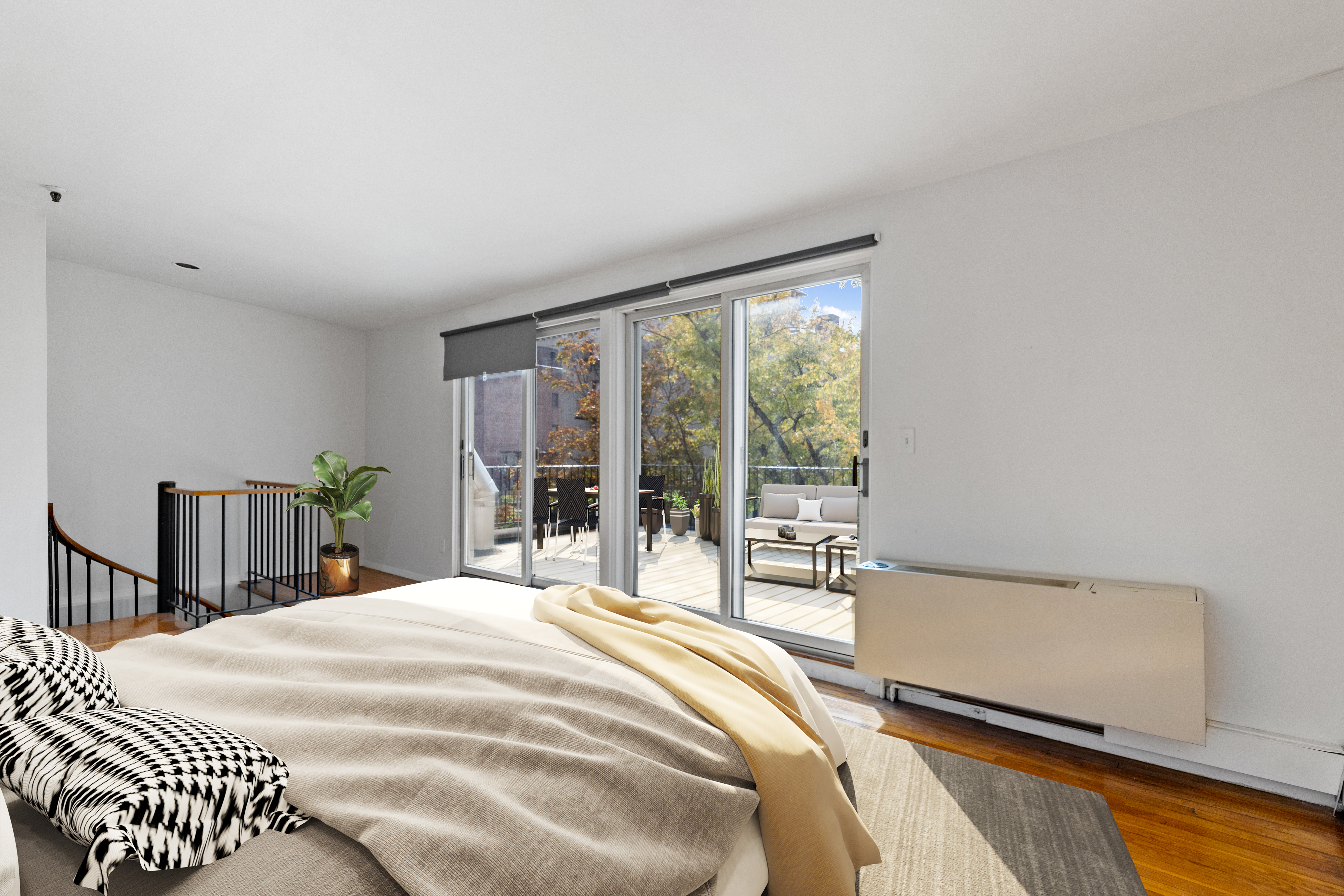 136 East 30th Street, Unit 3R Manhattan, NY 10016 - Photo 4 of 23 a bedroom with a bed and a large window