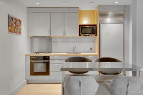 a kitchen with a stove and a microwave