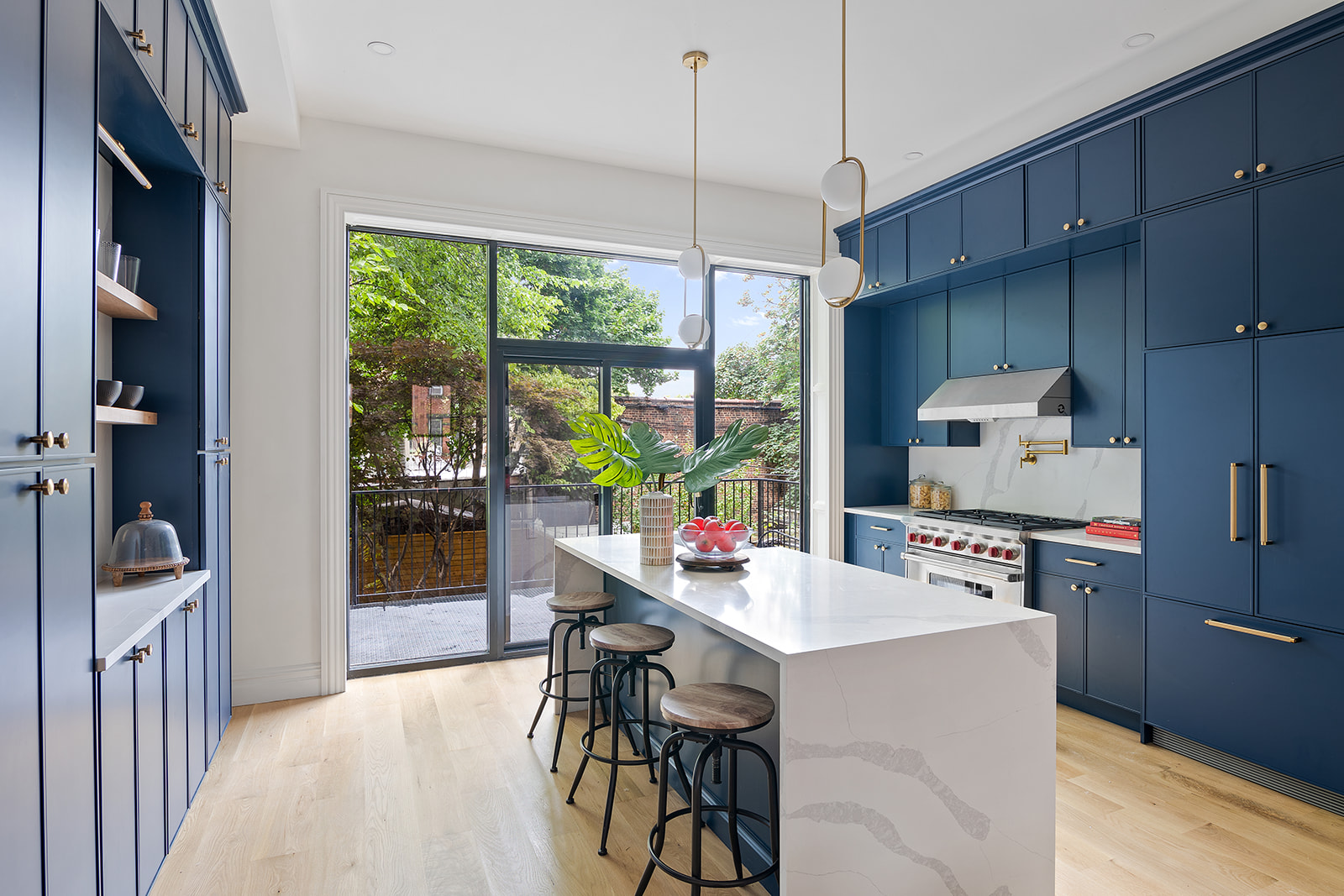 371 Herkimer Street Brooklyn, NY 11213 - Photo 3 of 16 a kitchen with a table chairs refrigerator and cabinets
