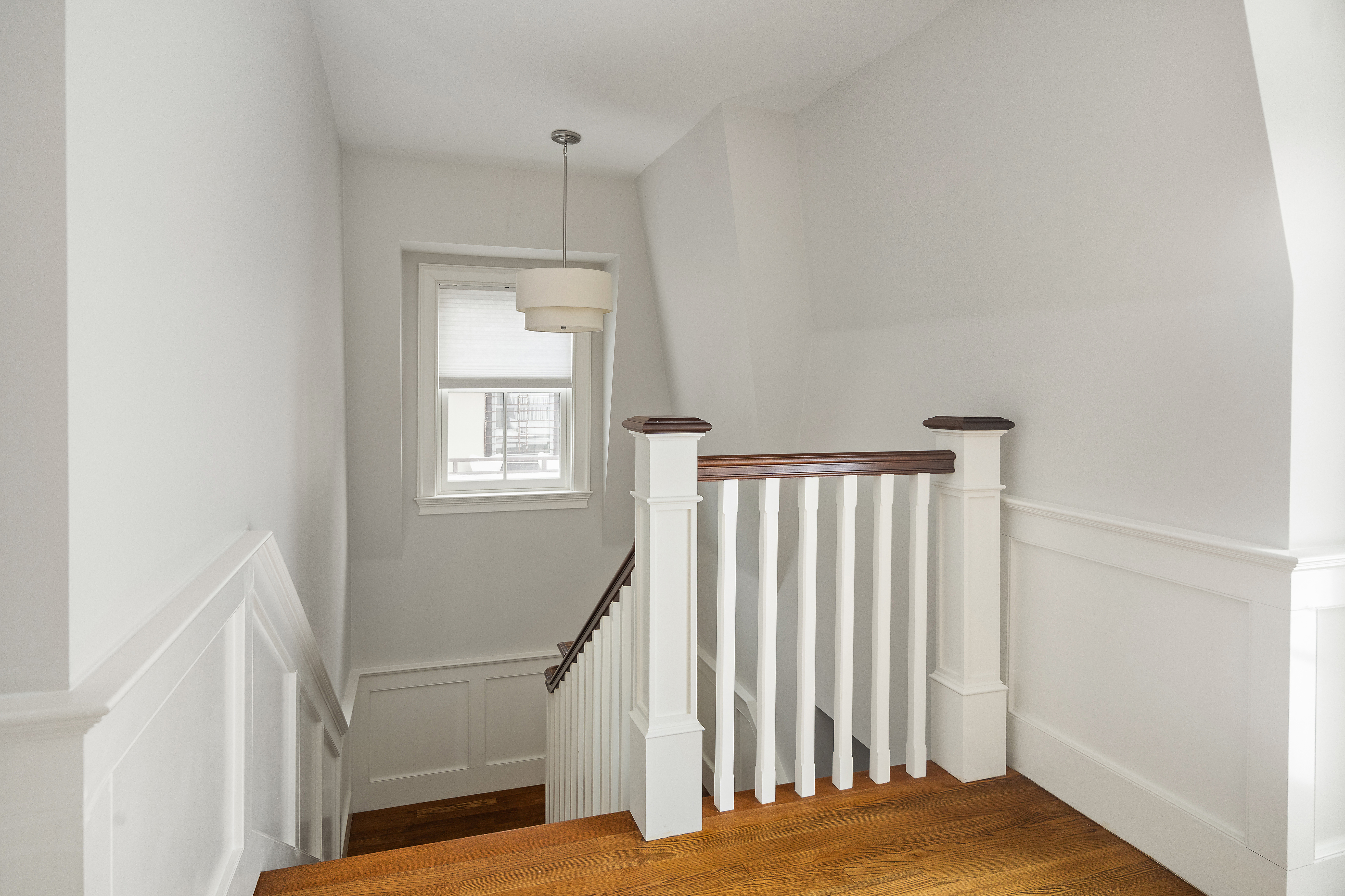35 Willard Street Cambridge, MA 02138 - Photo 21 of 36 a view of a bedroom with wooden floor and stairs