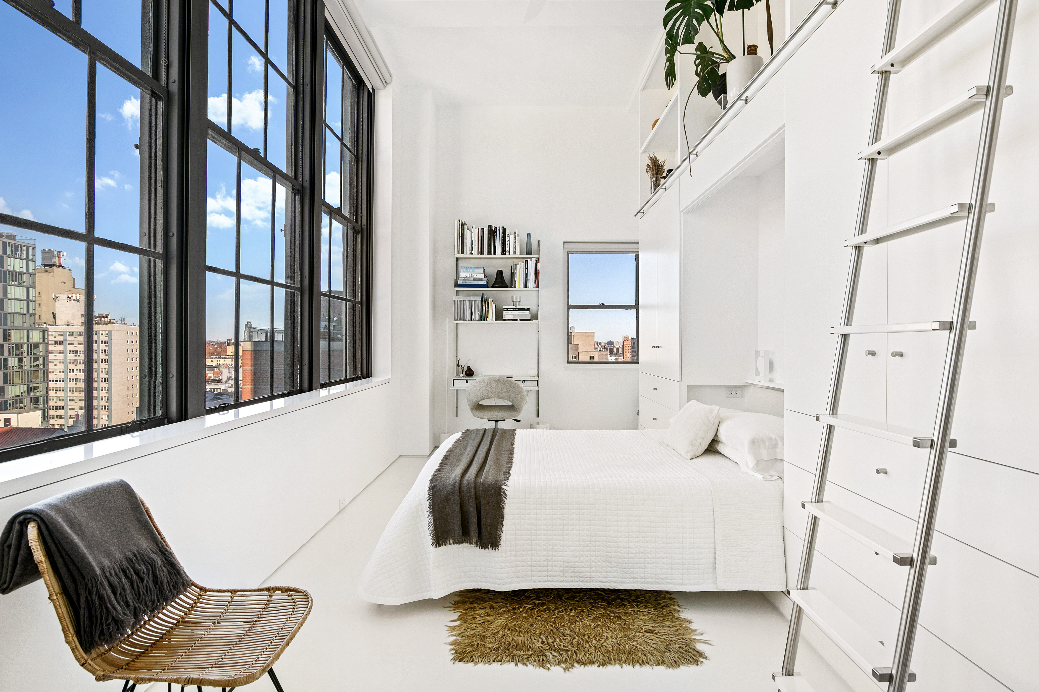 111 4th Avenue, Unit 9M Manhattan, NY 10003 - Photo 6 of 14 a bedroom with a bed and wooden floor