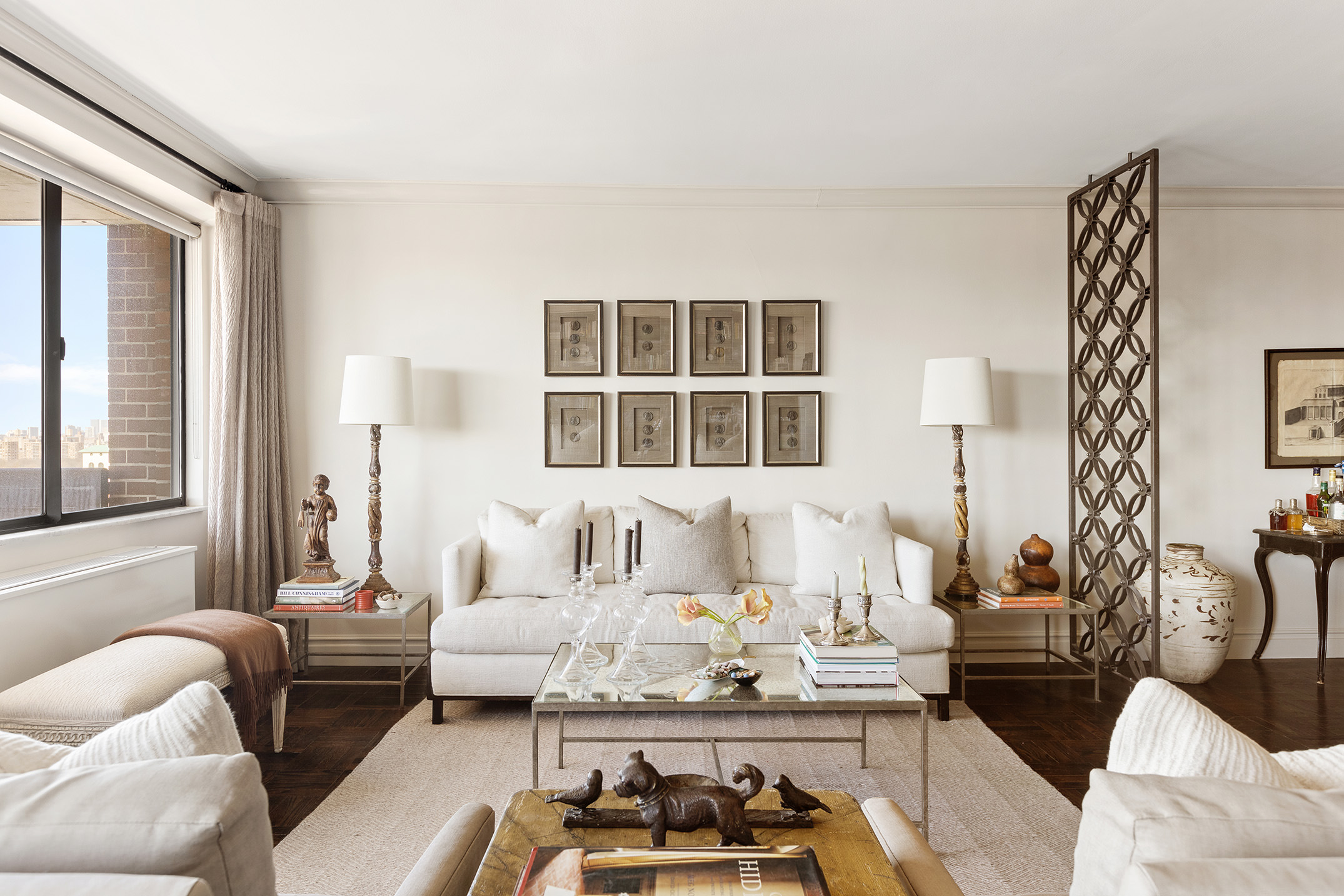40 East 80th Street, Unit 24A Manhattan, NY 10075 - Photo 2 of 11 a living room with furniture fireplace and a large window