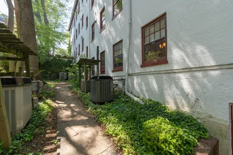 a view of a garden with a building