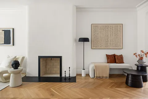 a bedroom with a bed and a potted plant