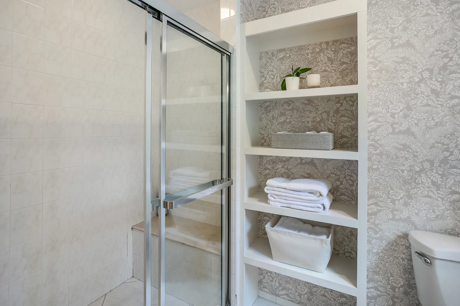 a bathroom with a shower and toilet