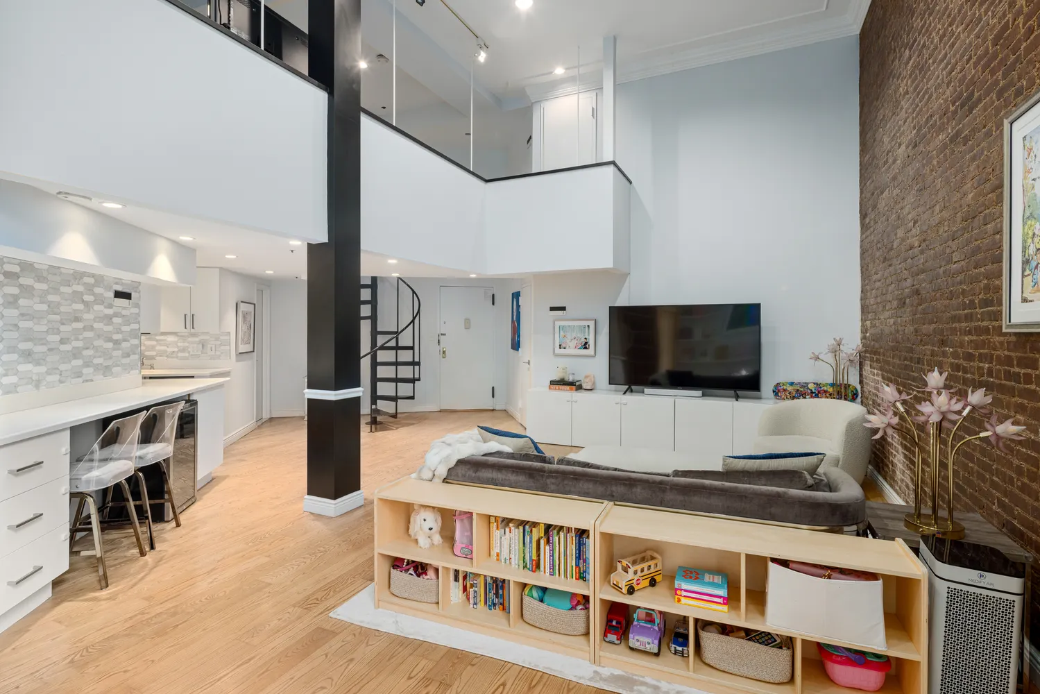 a living room with furniture and a flat screen tv