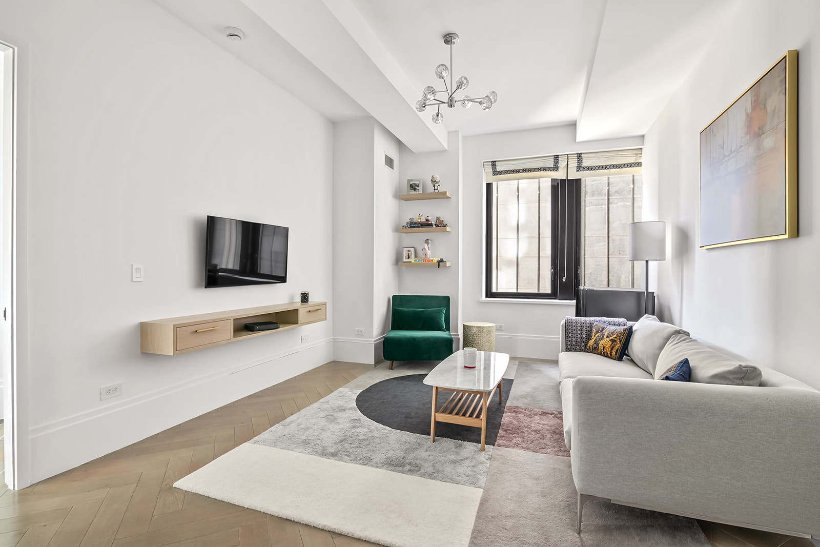 a living room with furniture and a flat screen tv